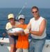 7-22 - Ms. Robyn Chargo and her son show off a Skipjack Tuna.