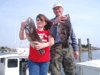 4-18 - 11-year old April with her pool winning 6 1/2 pound tog...her proud father Joe has a nice fish of his own.