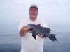 8-27 - Mike Pickert shows off one of our jumbo sea bass from an open boat trip.